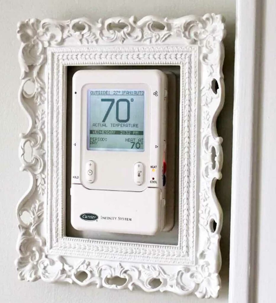 Hiding-a-thermostat-in-a-frame-on-the-wall-so-no-one-will-notice-it-933x1024[1]